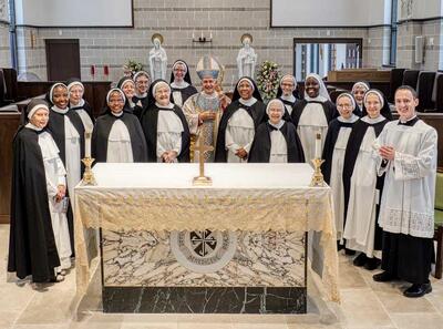 The nuns gather with Bishop Paprocki following the dedication.