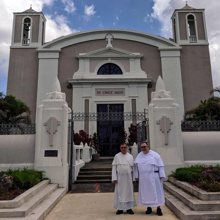Two Dominicans in front of a church