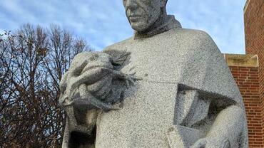 St. Albert the Great pondering a frog. Statue at St. Albert the Great Parish, Minneapolis, Minnesota