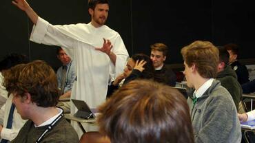 Brother teaching a class