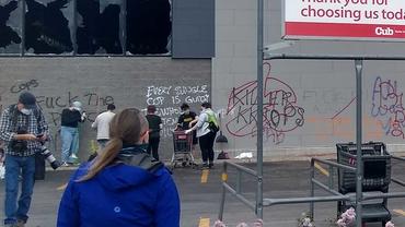 Volunteers clean up after the riots
