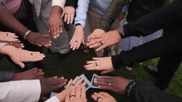 Hands wearing commissioning rings