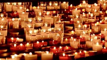 photograph of multiple votive candles