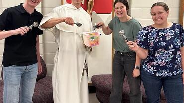 Photograph of Dominican friar with students 2024