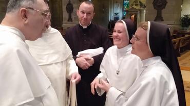 Color photo of Dominican friars and sisters in St. Paul's